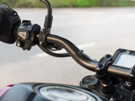 close-up-photograph-biker-woman-holding-handlebar-motorcycle